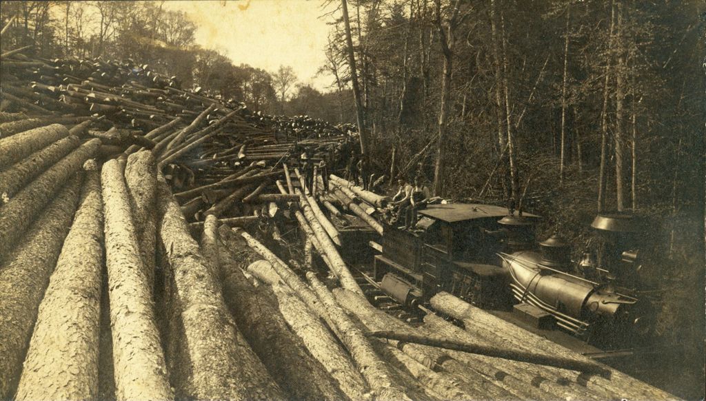 Miniature of Men loading logs onto a train car