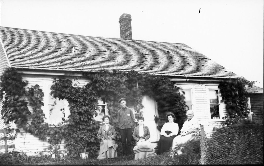 Miniature of Family portrait in front of a house