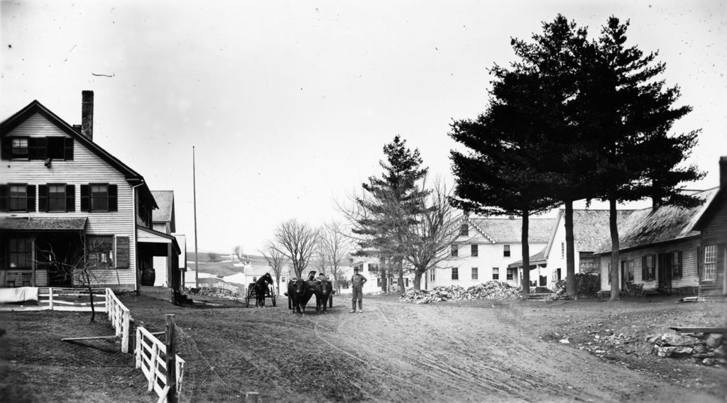 Miniature of Village view with team of oxen on road