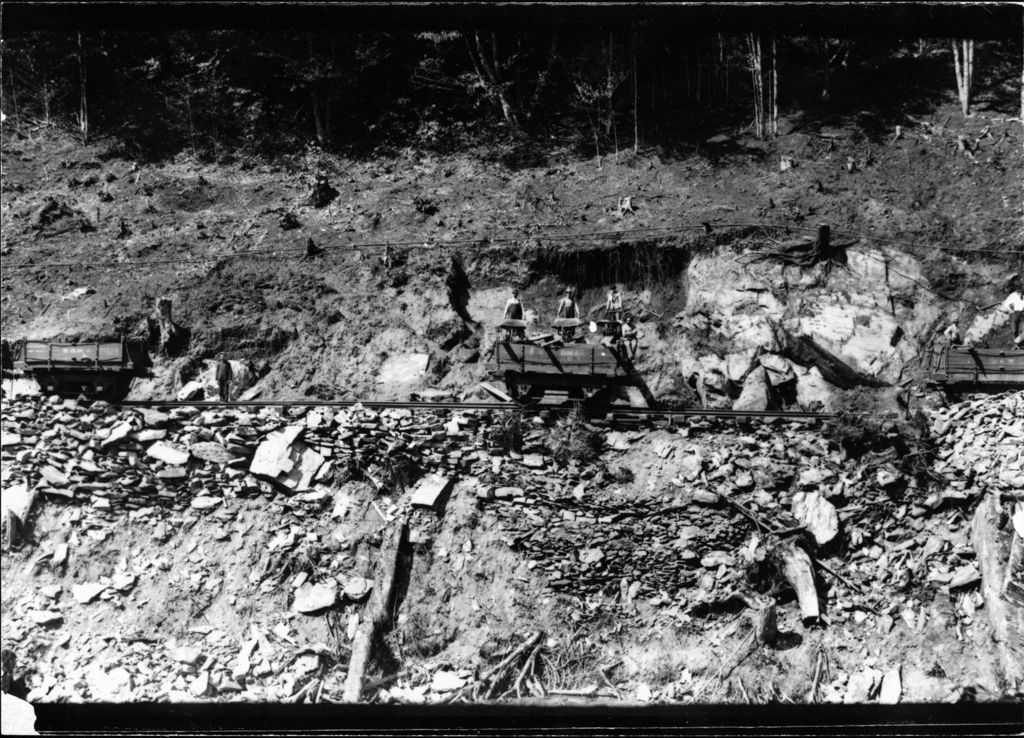 Miniature of Railroad workers loading dirt into train cars