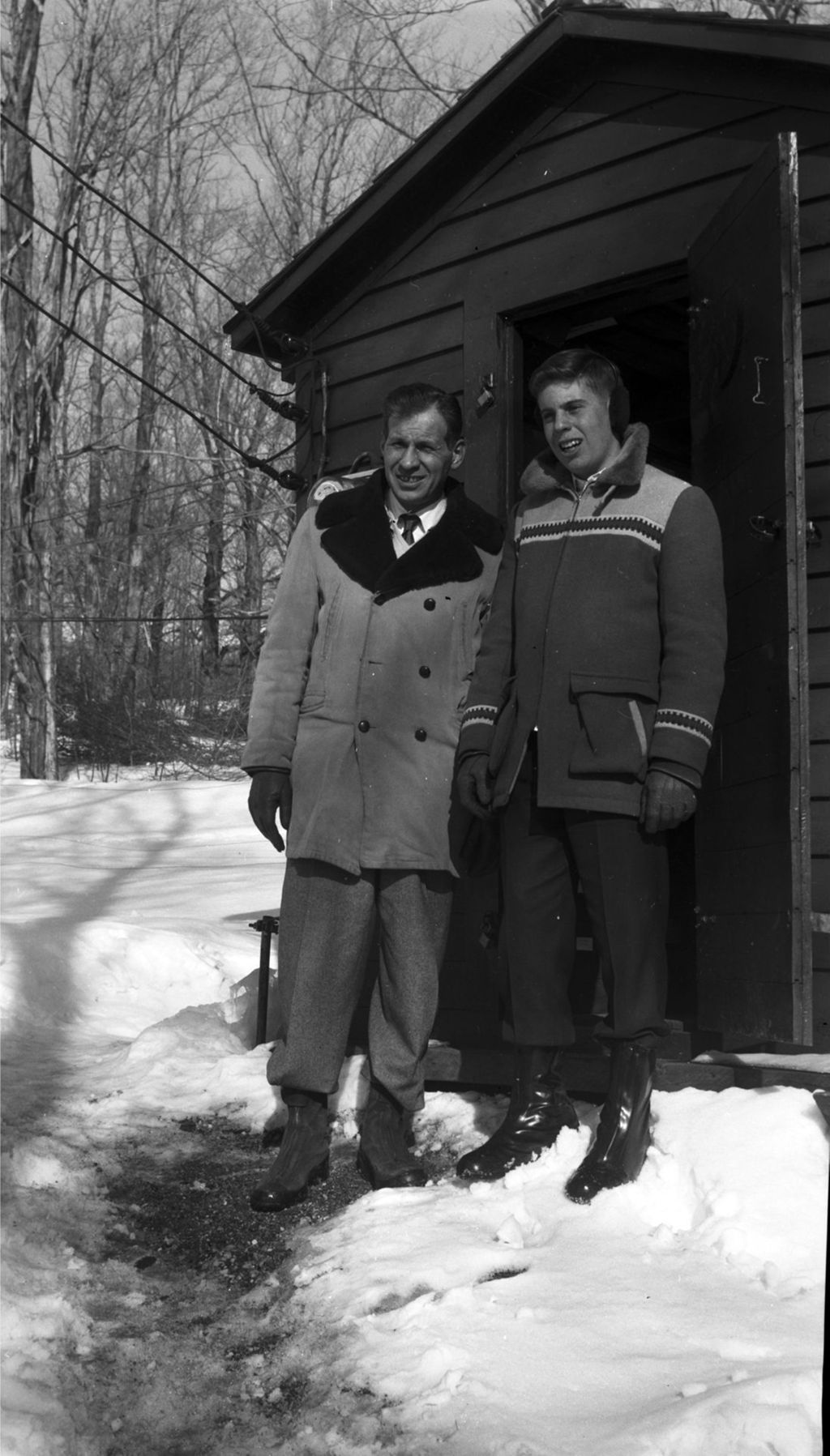 Miniature of Al Winston and son outside research shed