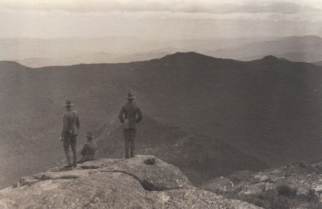 Miniature of Men looking out at ridgeline