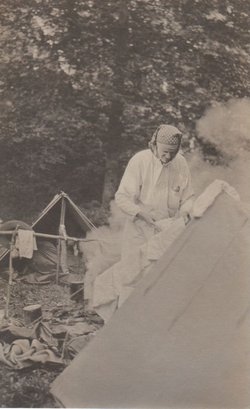 Miniature of Man at tent doing laundry