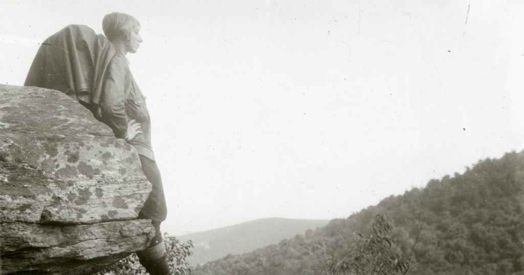 Miniature of Woman looking out from a rock ledge