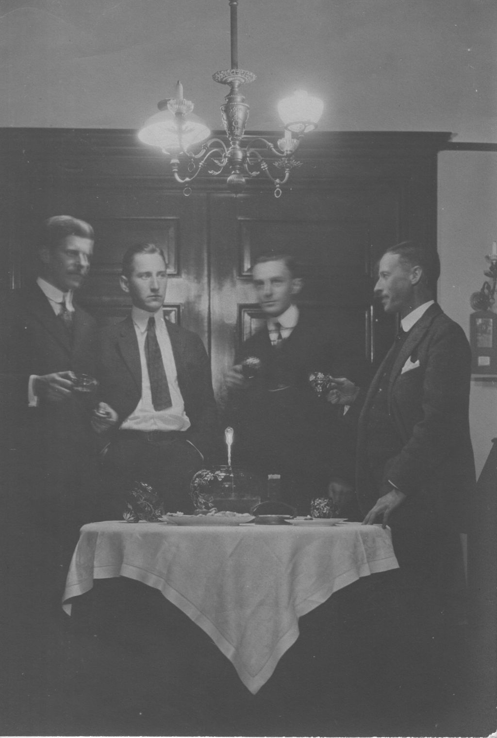 Miniature of Congdon and men around a formal table