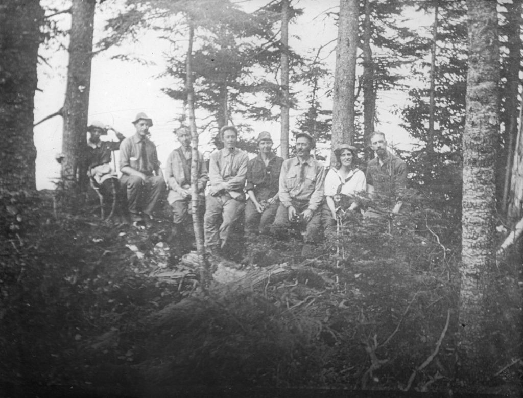 Miniature of Party posed along a log