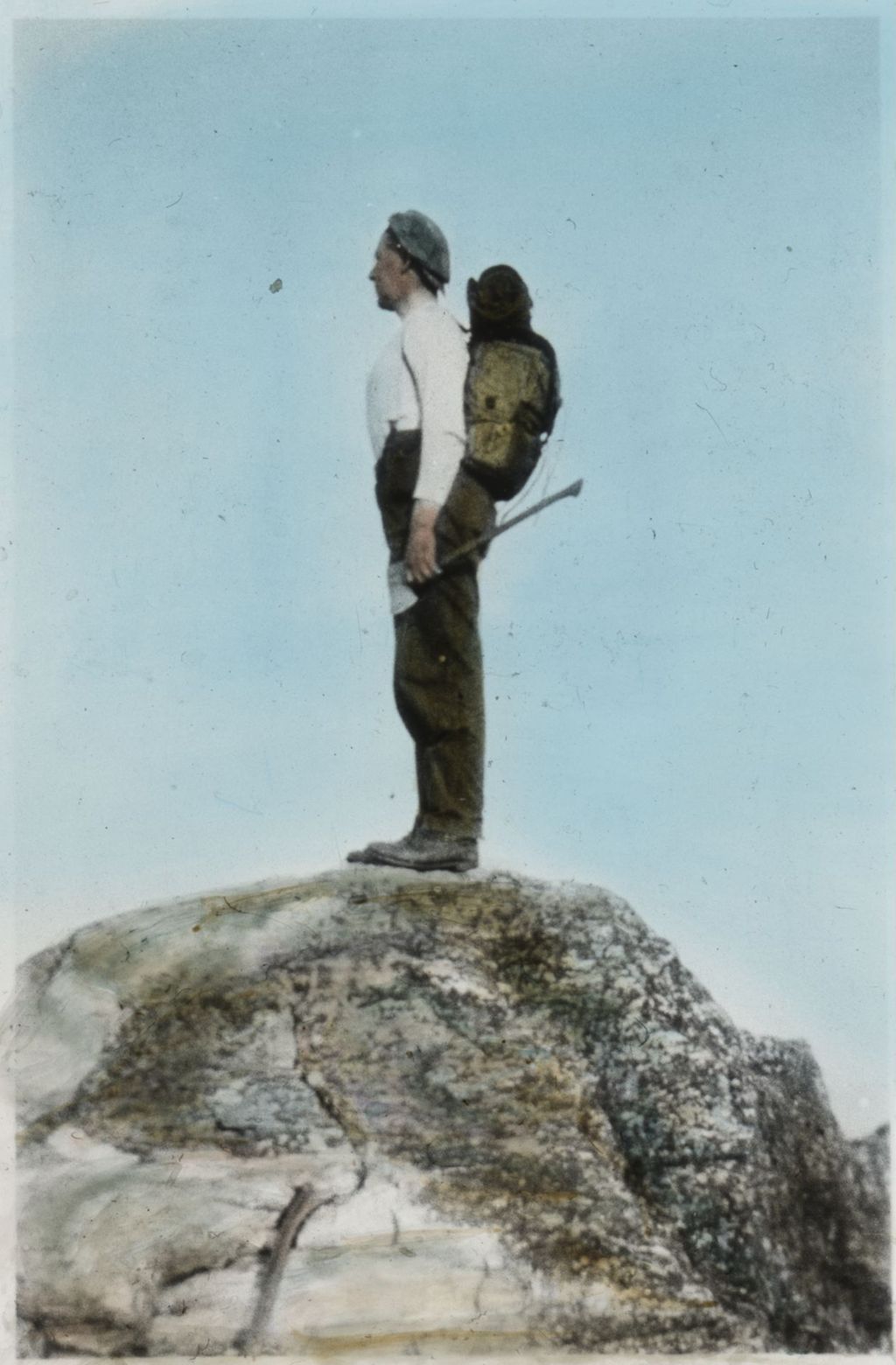 Miniature of Dean with axe on mountain summit