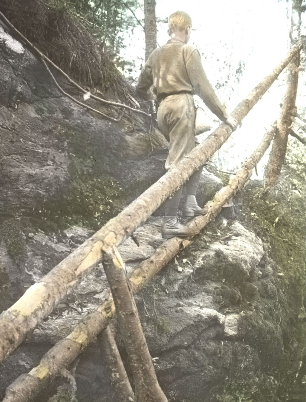 Miniature of Lyman Burnham climbing the ladder on Burnt Rock Mountain