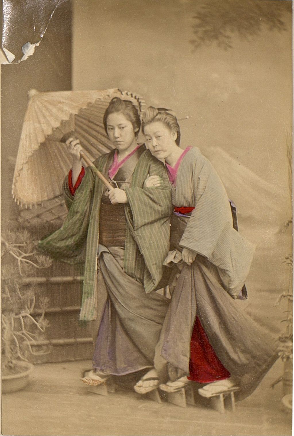 Miniature of Two women posing in front of a mural of Mt Fuji