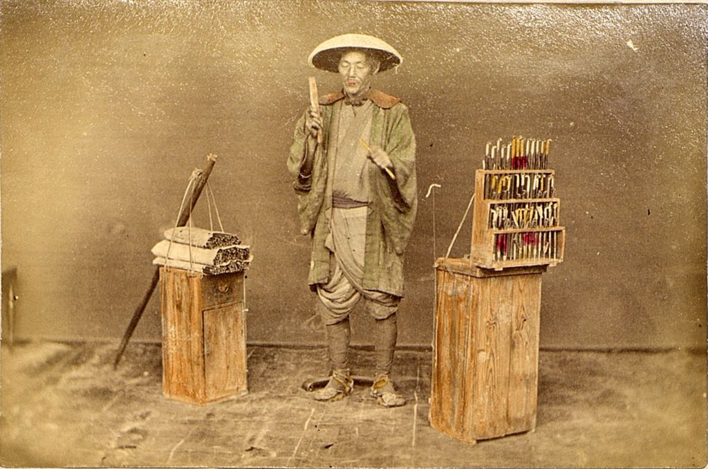 Miniature of Street vendor with small pipes on display