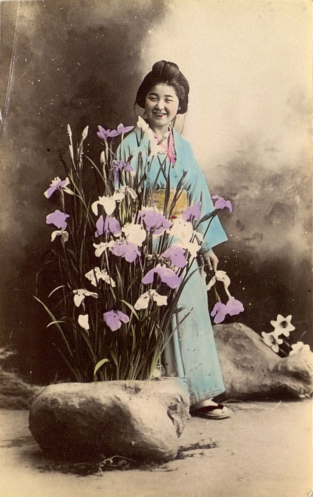 Miniature of Woman admiring flowers