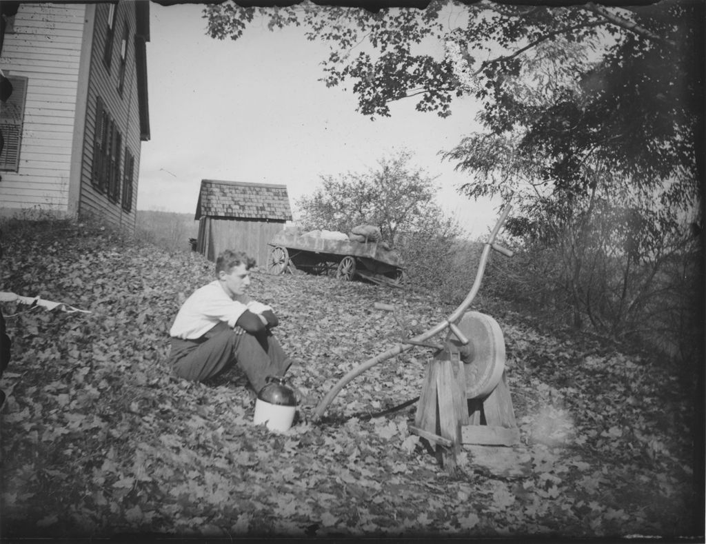 Miniature of Porter Thayer next to grindstone at Abbie Adams residence, Williamsville, Vt.