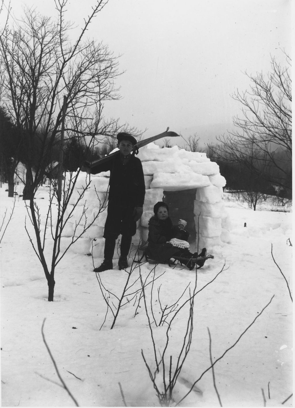 Miniature of Webster and Ruth Thayer, Porter Thayer's children, with snow house and skis